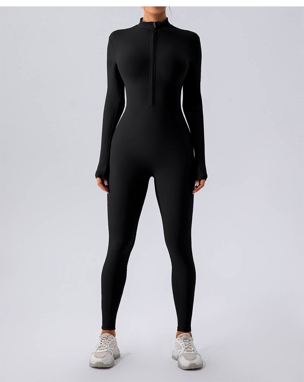 Black fleece-lined yoga jumpsuit with stretchy nylon fabric for warmth and flexibility during workouts