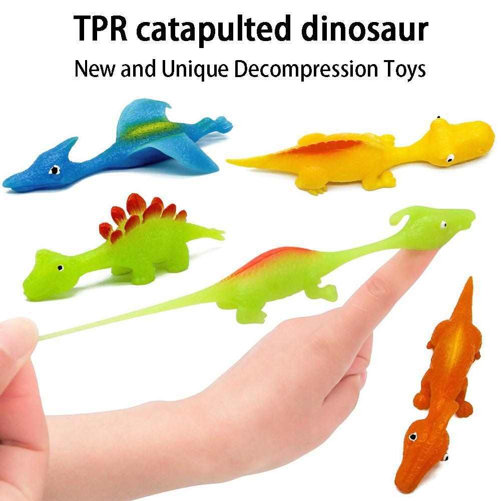 Slingshot Dino-Launch finger toy with dinosaur design ready to launch