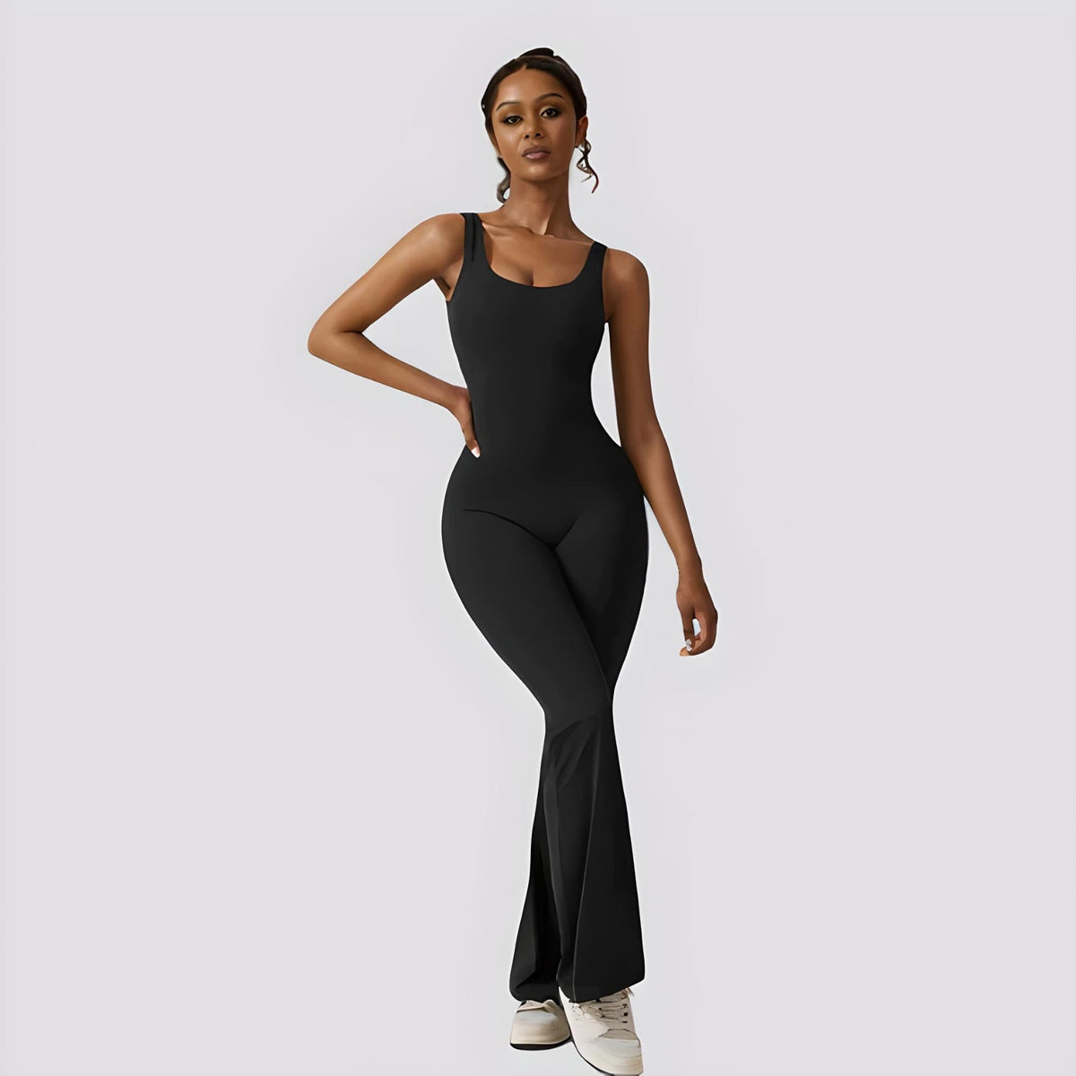 woman wearing stylish flared jumpsuit with fitted bodice