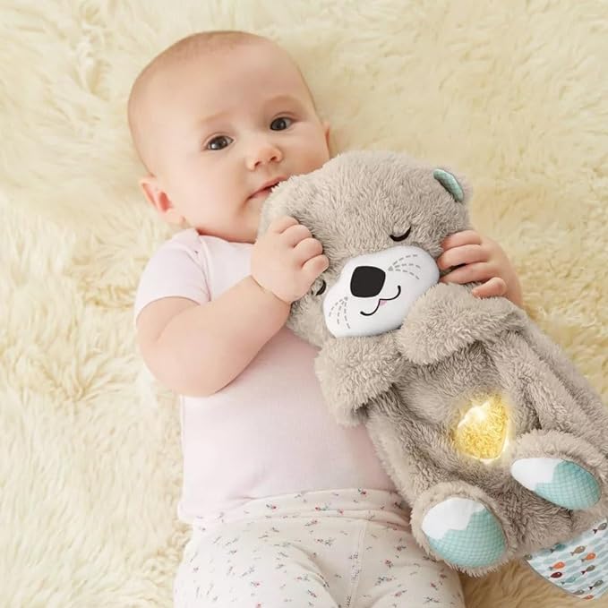 Portable otter plush sound machine with soothing music and rhythmic breathing